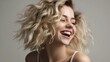 © Tuyres - Close-up portrait of a fictional blonde model laughing candidly, isolated on a studio. Generative AI illustration.