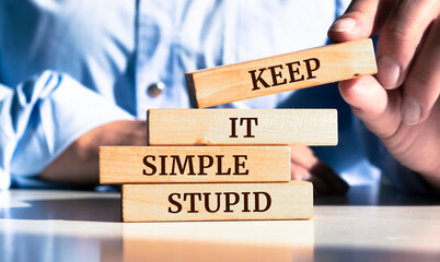 close up on businessman holding a wooden block with 