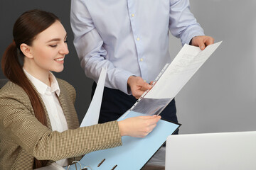 Canvas Print - Businesspeople working together with documents in office