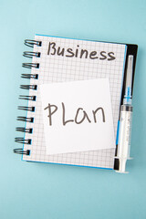 Wall Mural - top view open copybook with plan note and injection on blue background color school college virus co