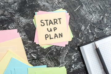 Wall Mural - top view start up plan note on sticker on gray background lesson student note school paper study sti