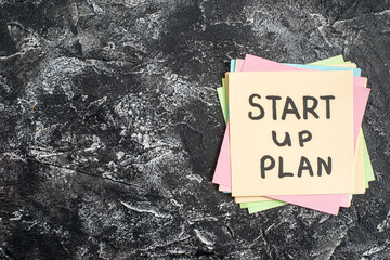 Wall Mural - top view start up plan note on sticker on the gray background lesson student note paper study sticke