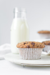 Sticker - Homemade chocolate chip muffins with selective focus, bakery style chocolate chip muffins with white liners