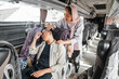 © Odua Images - Young man feeling sick and a woman try to help him while sitting on a bus