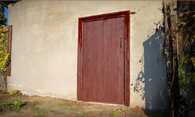 Wall Mural - Old wooden door to a vintage dwelling