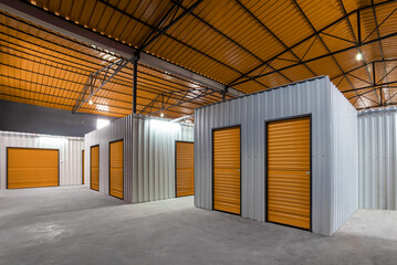 Corridor of self storage unit with red doors. Rental Storage Units