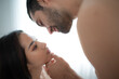 © Wosunan - Gorgeous sexy couple enjoying arousing sex before having sex on bed in home bedroom The concept of emotional and love relationships.