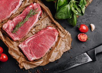 Wall Mural - Raw strip loin steaks on baking paper