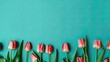 © Gelpi - Tulips border with copy space on a colored background. Beautiful frame composition of spring flowers. Generative AI