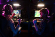 © Drobot Dean - Two male gamers screaming and celebrating victory while playing video game on tournament in cybersport club