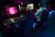 © Drobot Dean - Team of gamers playing online game on a championship in cybersport club