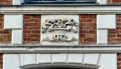 Wall Mural - bas-reliefs carved on a facade of Heroes square in Arras, Northern France