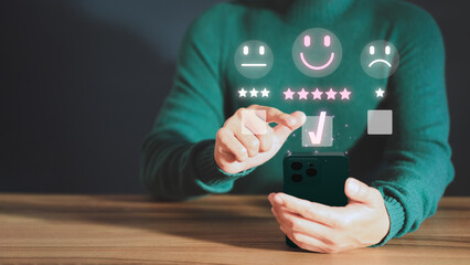 Poster - Customer service experience assessment and business satisfaction survey. Man hand using a mobile phone with popup smile face icon for feedback review satisfaction service opinion and testimonial.