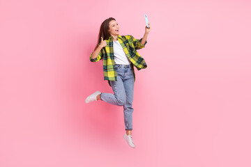 Poster - Full body photo of carefree youngster funny woman jump thumb up recommend selfie face portrait popular blogger isolated on pink color background