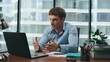 © stockbusters - Man conducting education webinar using laptop in office close up. Online meeting