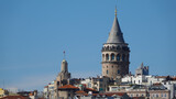 Fototapeta  - Istanbul city skyline in Turkey, Beyoglu district old houses with Galata tower on top, view from the Golden Horn in Eminönü side.