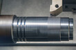 © Pixel_B - The CNC lathe machine thread cutting at the end of metal shaft  parts.