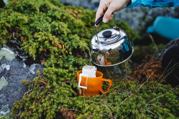 Sticker - Tea party in nature, tourist food, coffee in the mountains, a hot drink for vivacity with caffeine, a metal kettle.