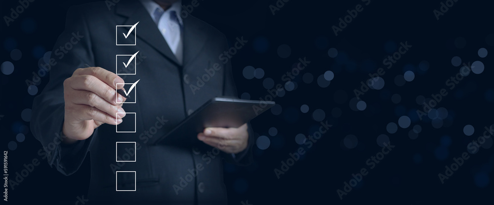 Manager Using Checklist Business Management in Action: A Businessperson or a Manager Checking ...