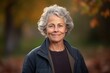© Robert MEYNER - Portrait of a smiling senior woman in the park on an autumn day