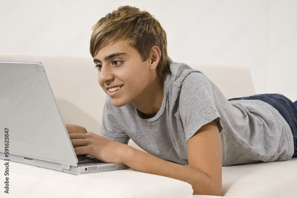 Teenage Boy Using Laptop Stock Photo | Adobe Stock