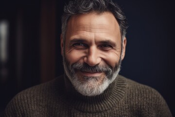 Wall Mural - Close up portrait of a handsome mature man with grey hair and beard.