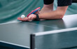 close up of a professional table tennis player serving