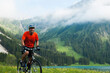 © Designpics - Mature Man Riding Mountain Bike by Vilsalpsee, Tannheim Valley, Tyrol, Austria