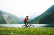 © Designpics - Mature Man Riding Mountain Bike by Vilsalpsee, Tannheim Valley, Tyrol, Austria