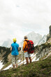 © Designpics - Backview of mature couple hiking in mountains, Tannheim Valley, Austria
