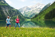 © Designpics - Couple Hiking by Lake, Vilsalpsee, Tannheim Valley, Tyrol, Austria
