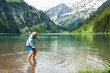 © Designpics - Mature man skipping stones at Lake Vilsalpsee, Tannheim Valley, Austria