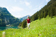 © Designpics - Mature woman power walking, Lake Vilsalpsee, Tannheim Valley, Austria