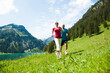 © Designpics - Mature man and woman power walking, Lake Vilsalpsee, Tannheim Valley, Austria