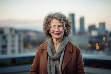 Sticker - Portrait of senior woman with eyeglasses against view of the city