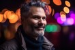 © Robert MEYNER - Portrait of a handsome middle-aged man in the city at night