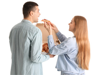 Canvas Print - Happy young couple eating fresh pizza on white background