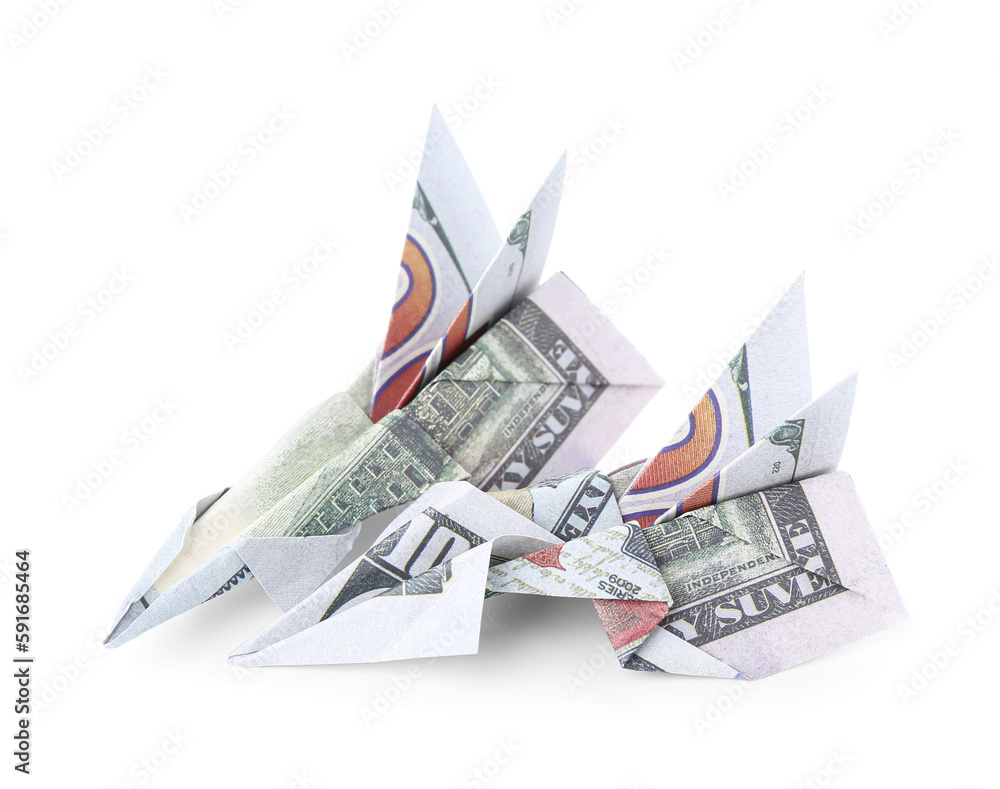 Origami airplanes made of dollar banknotes on white background