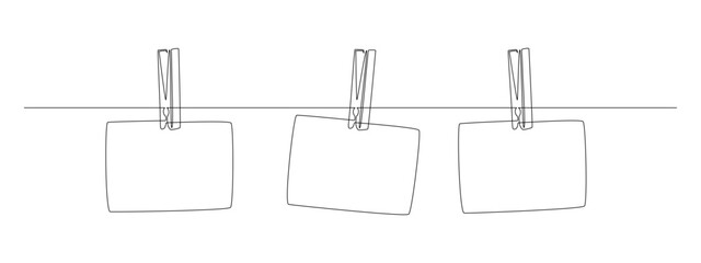 Aufkleber - Photo frames hanging on the rope with clothespins in one continuous line drawing. Clothesline with pin and peg for photo album design concept in simple linear style. Editable stroke. Vector