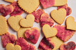 © The Picture Pantry - Stamped Heart Cut-Out Cookies with Pink Sugar on a Pink Marble Background