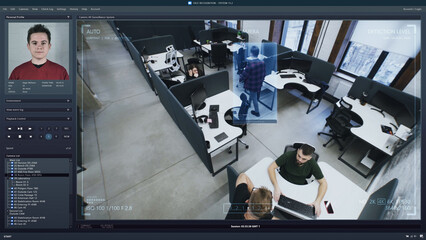 Playback office CCTV camera on computer. People work in coworking office. AI software with facial recognition and personal profiles. Security camera. Face scanning system. Surveillance and monitoring.