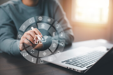 Hand using AI smart tablet with smart home app on the room, circular interface of the smart home automation assistant on the virtual screen and user touches the button, smart home digital interface
