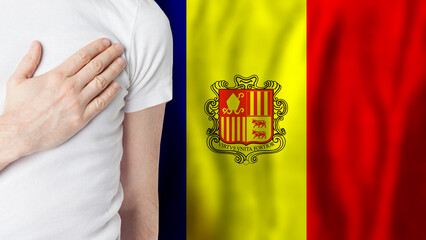 Andorran person with hand on heart on the background of Andorra flag. Patriotism, country, national, pride concept