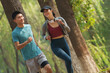 © View Stock - Young couples to running in the woods