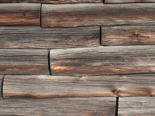 Wall Mural - Wood texture on the wall of a wooden log house, close-up, wooden buildings on Kizhi Island, Karelia, northern Russia.