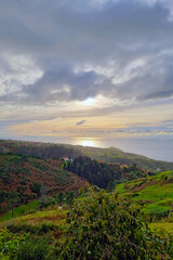 Wall Mural - Beautiful view of the sunset in the ocean from the island.