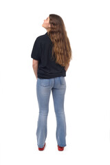 Wall Mural - back view of young girl  looking up on white background