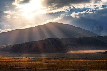 Asphalt road in the middle of the mountain during sunset