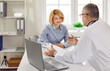 © Studio Romantic - Female mature patient visiting a doctor holding report file with appointment at the medical office in hospital and giving consultation a woman during medical examination in clinic.