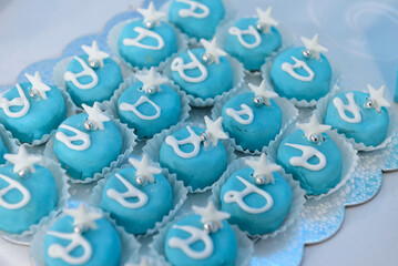 Sticker - Closeup of blue cupcakes with white stars and decorations